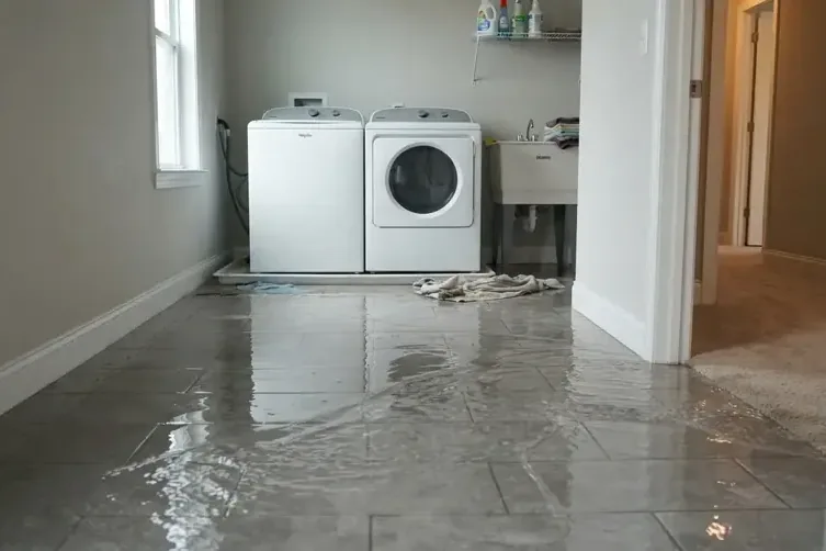 Floor flooded by a failed washing machine supply hose