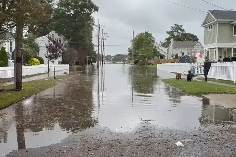 Residential street under storm water with homes on both sides