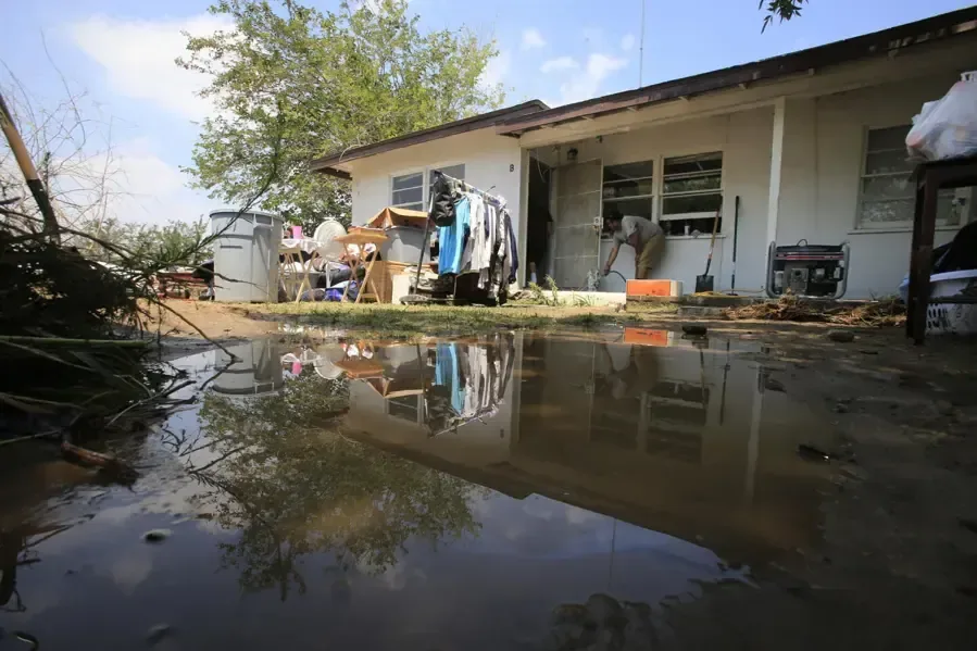 Storm water pooled around a single-story home after a heavy Gulf storm